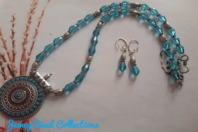 Light Blue Oval Crystals with Silver Enamel Pendant